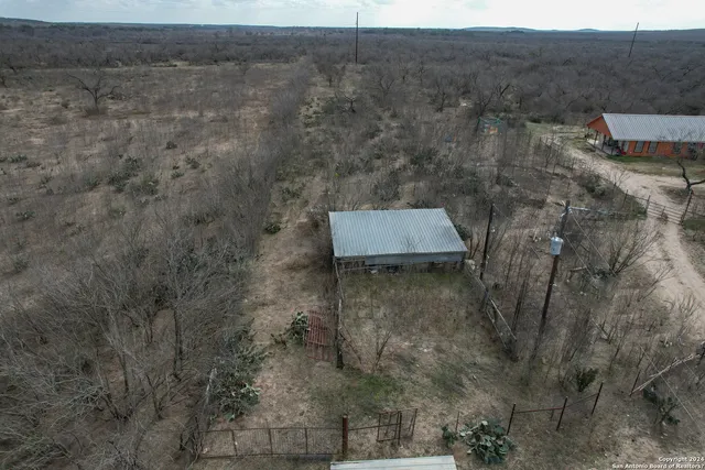 a aerial view of a house with a yard