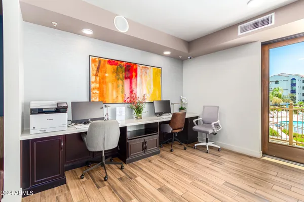 a kitchen with stainless steel appliances granite countertop a refrigerator a stove and a sink
