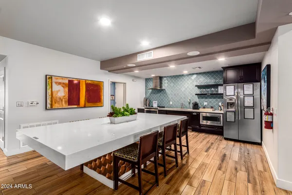 a living room with hardwood floor to ceiling window and wooden floor