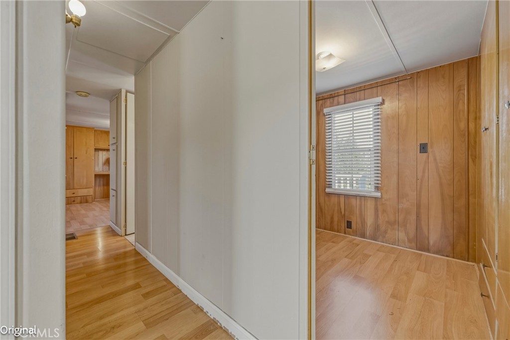 9810 Boat Club Snelling, CA 95369 - Photo 25 of 51 a view of a hallway with wooden floor and a bathroom