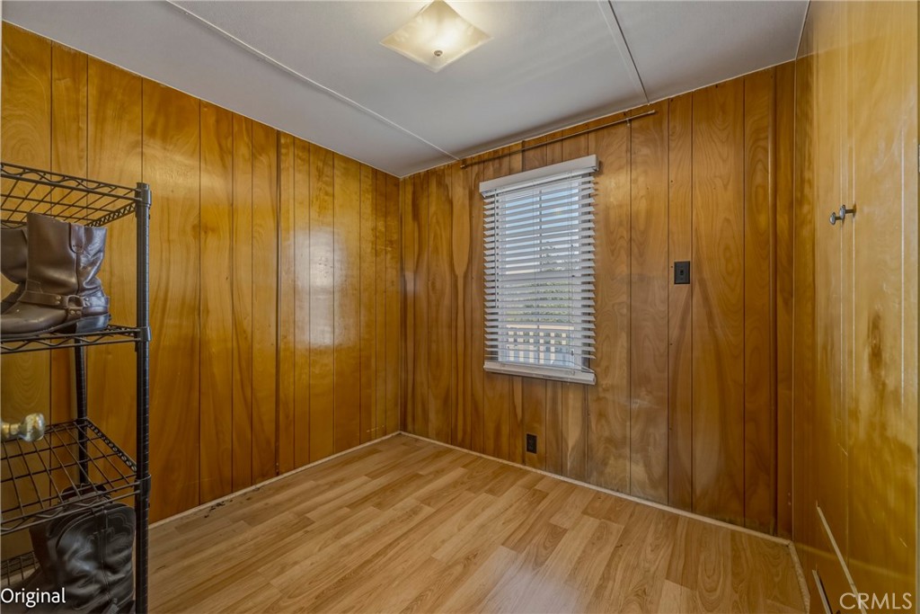 9810 Boat Club Snelling, CA 95369 - Photo 26 of 51 a view of an empty room with wooden floor and a window