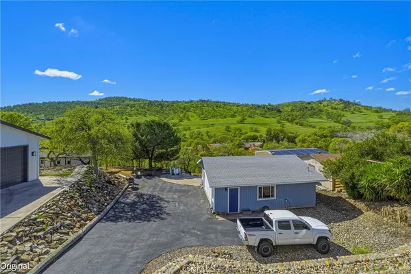 a view of a chairs and table in the patio