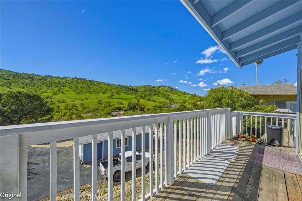 9810 Boat Club Snelling, CA 95369 - Photo 39 of 51 a view of a balcony with wooden floor & fence