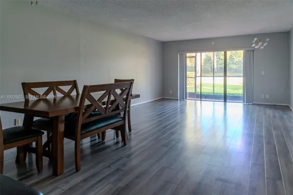 a view of a livingroom with furniture and wooden floor