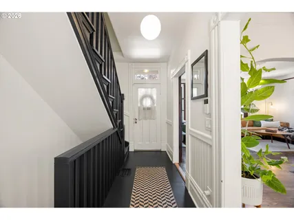 a view of hallway with wooden floor