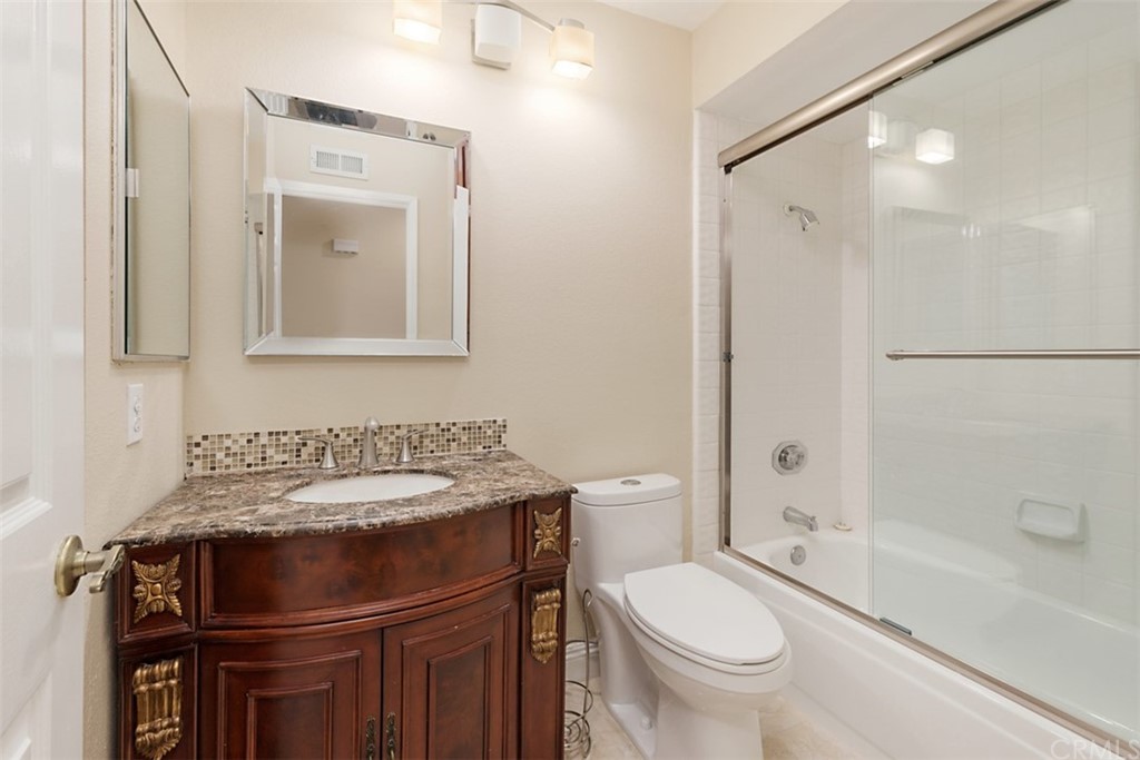 25666 Seaside Drive, Unit 134 Dana Point, CA 92629 - Photo 11 of 13 a bathroom with a sink toilet and shower