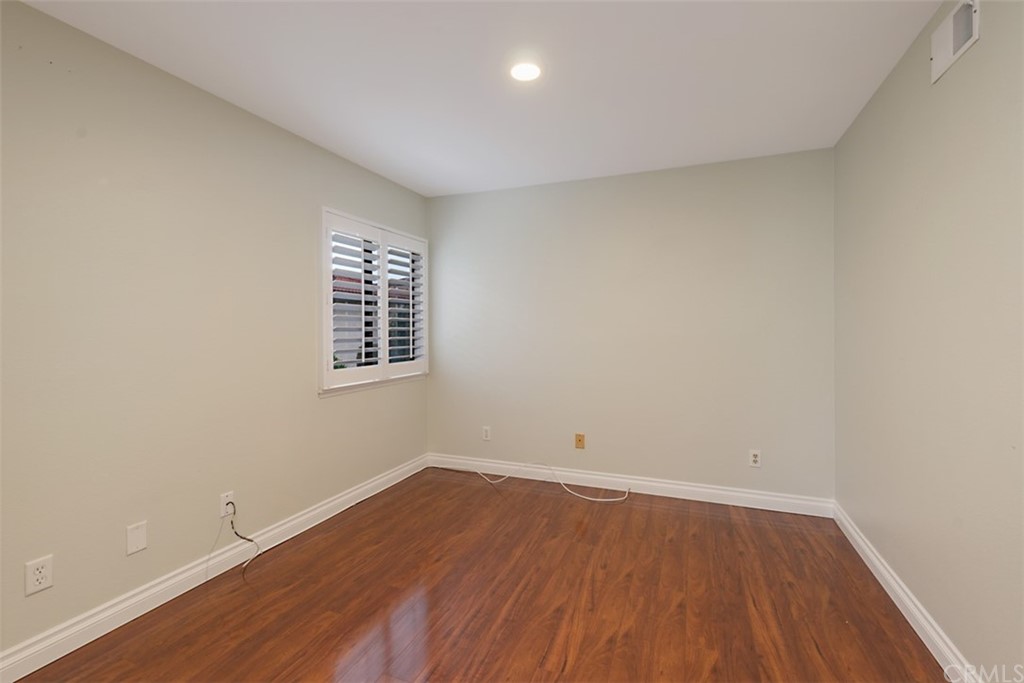 25666 Seaside Drive, Unit 134 Dana Point, CA 92629 - Photo 12 of 13 a view of a room with wooden floor and white walls