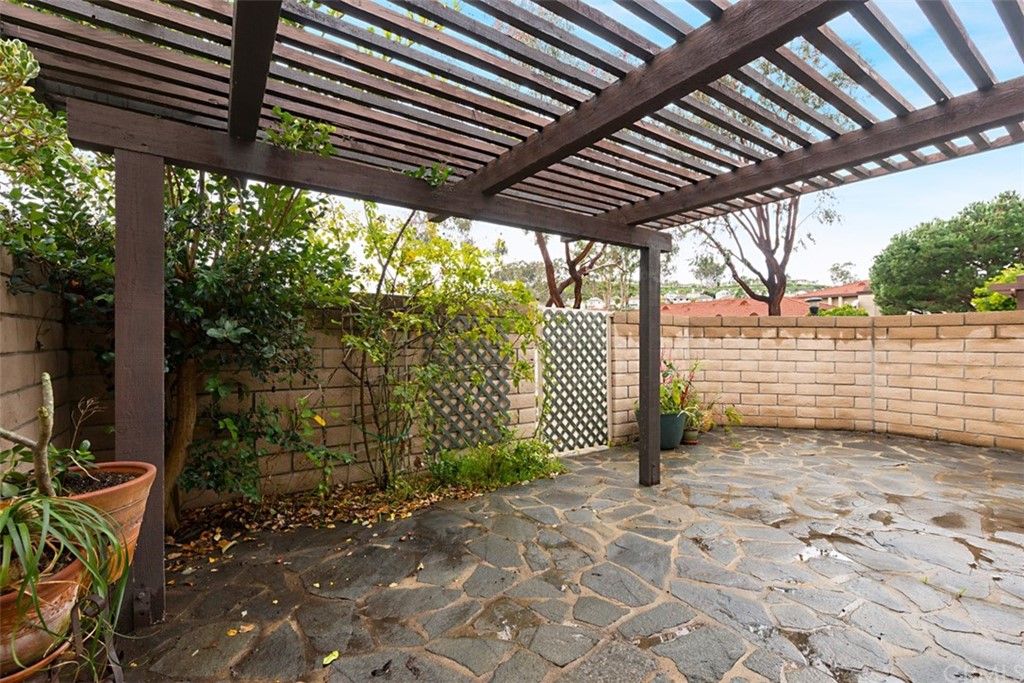25666 Seaside Drive, Unit 134 Dana Point, CA 92629 - Photo 13 of 13 a view of a backyard with wooden fence