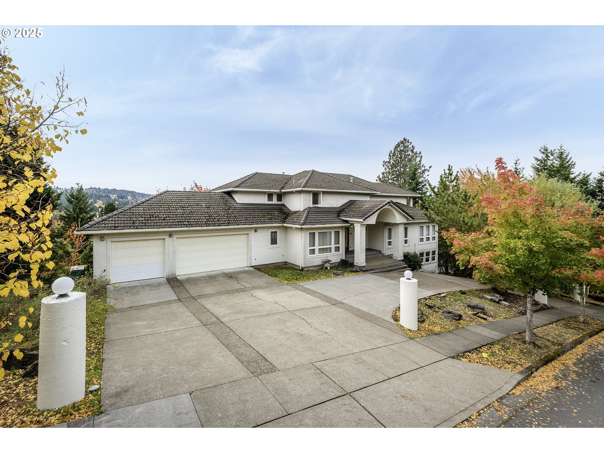 16333 Southwest Timberland Drive Beaverton, OR 97007 - Photo 1 of 42 a front view of a house with a garden and yard