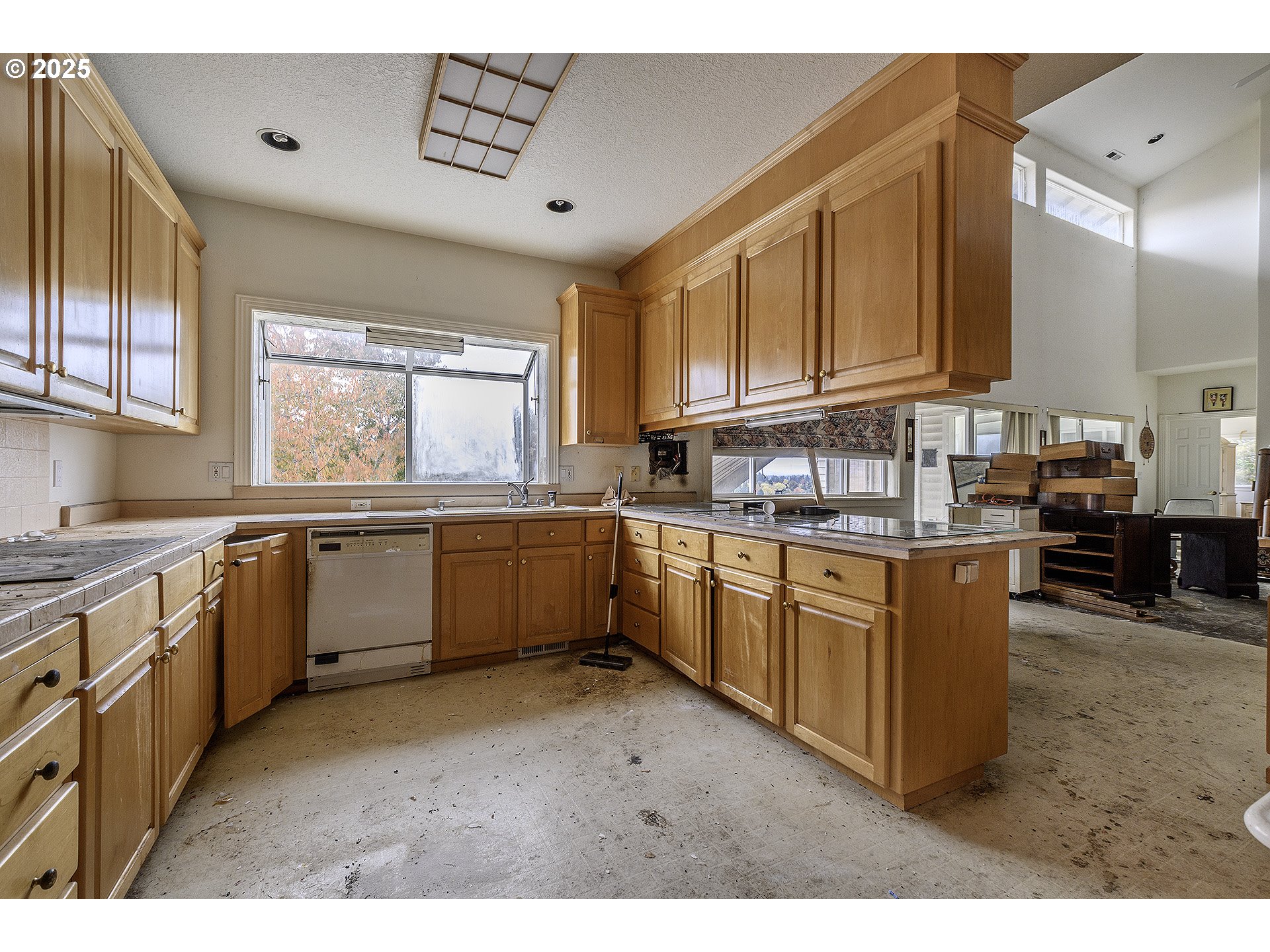 16333 Southwest Timberland Drive Beaverton, OR 97007 - Photo 6 of 42 a kitchen with a sink window and cabinets