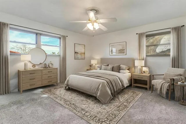 a bed room with two bed window and a dresser