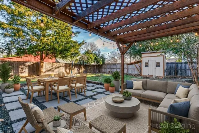 a living room with patio a couch and a grill
