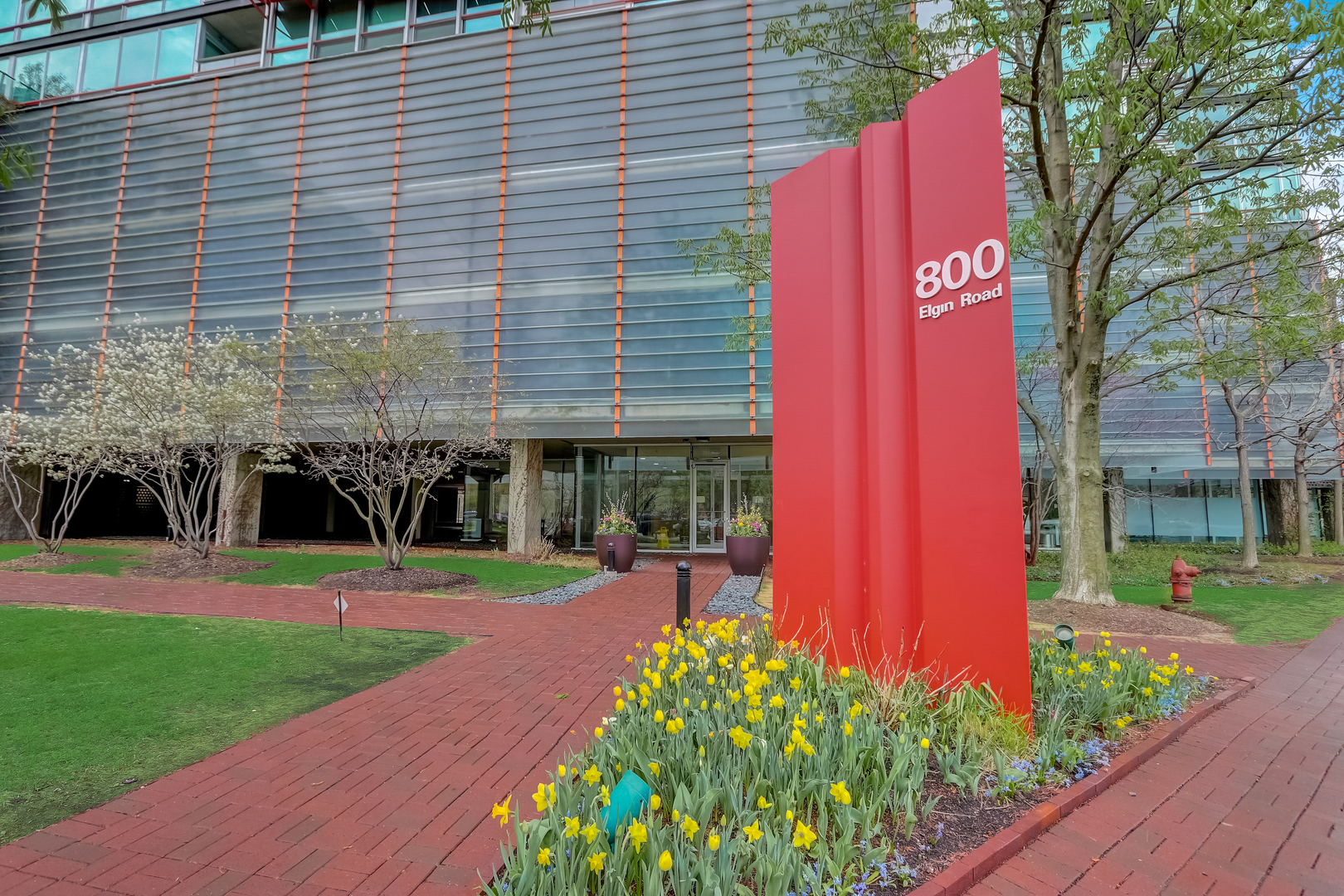 800 Elgin Road, Unit 1220 Evanston, IL 60201 - Photo 1 of 39 a front view of a house with garden