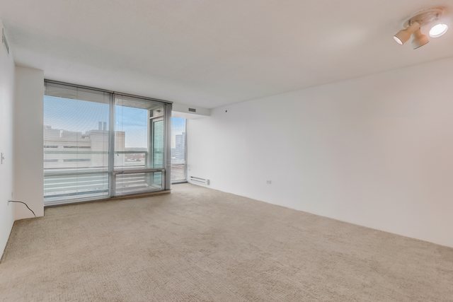 800 Elgin Road, Unit 1220 Evanston, IL 60201 - Photo 13 of 39 a view of an empty room with a fireplace