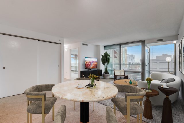 800 Elgin Road, Unit 1220 Evanston, IL 60201 - Photo 2 of 39 a view of a dining room with furniture and a potted plant