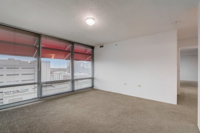 800 Elgin Road, Unit 1220 Evanston, IL 60201 - Photo 22 of 39 an empty room with sliding glass door