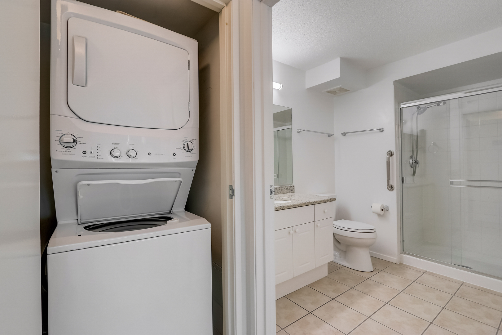 800 Elgin Road, Unit 1220 Evanston, IL 60201 - Photo 24 of 39 a bathroom with a toilet and a mirror