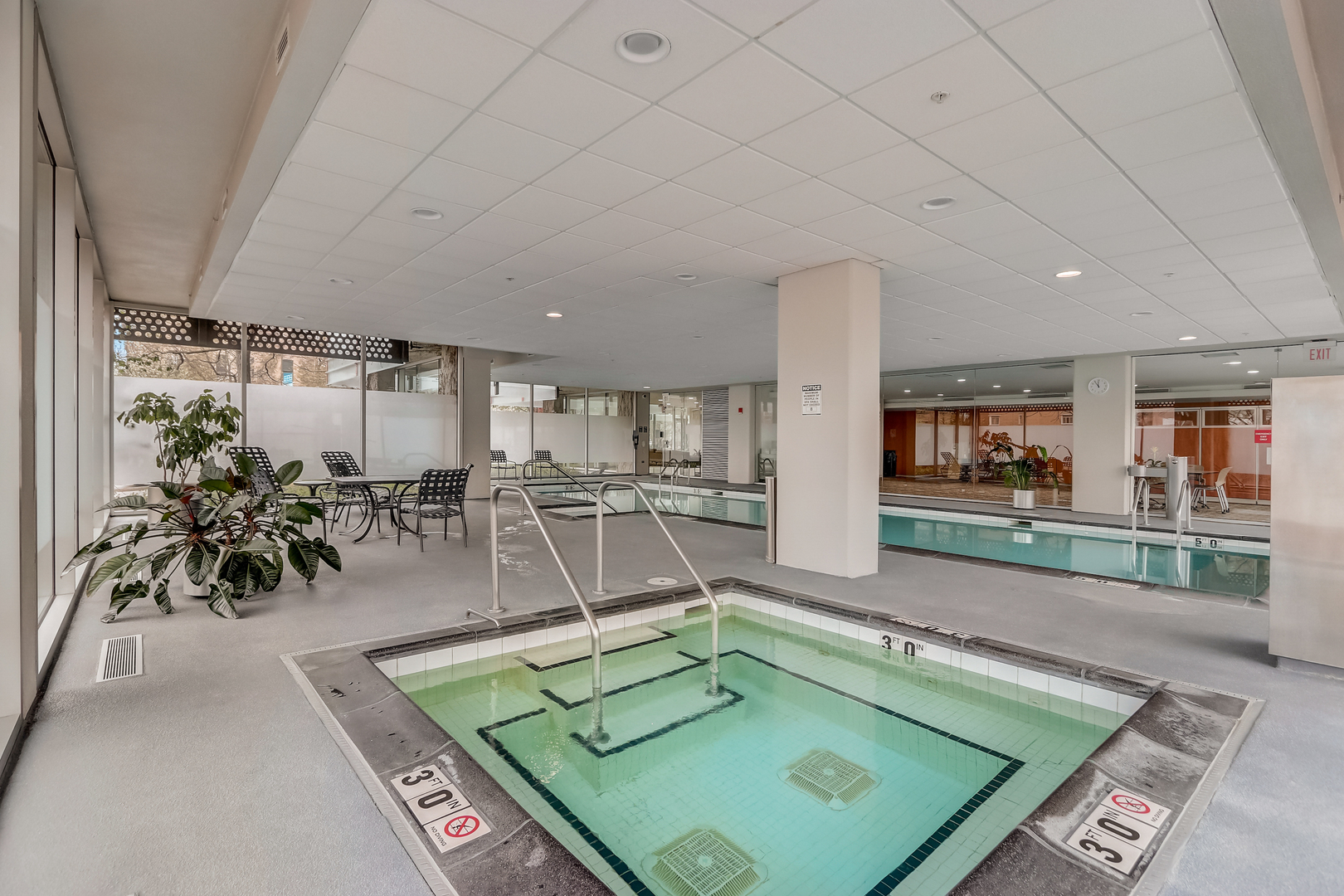 800 Elgin Road, Unit 1220 Evanston, IL 60201 - Photo 29 of 39 a room with lots of table and chairs