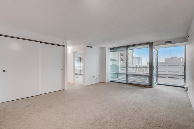 800 Elgin Road, Unit 1220 Evanston, IL 60201 - Photo 3 of 39 a view of an empty room with a cabinet