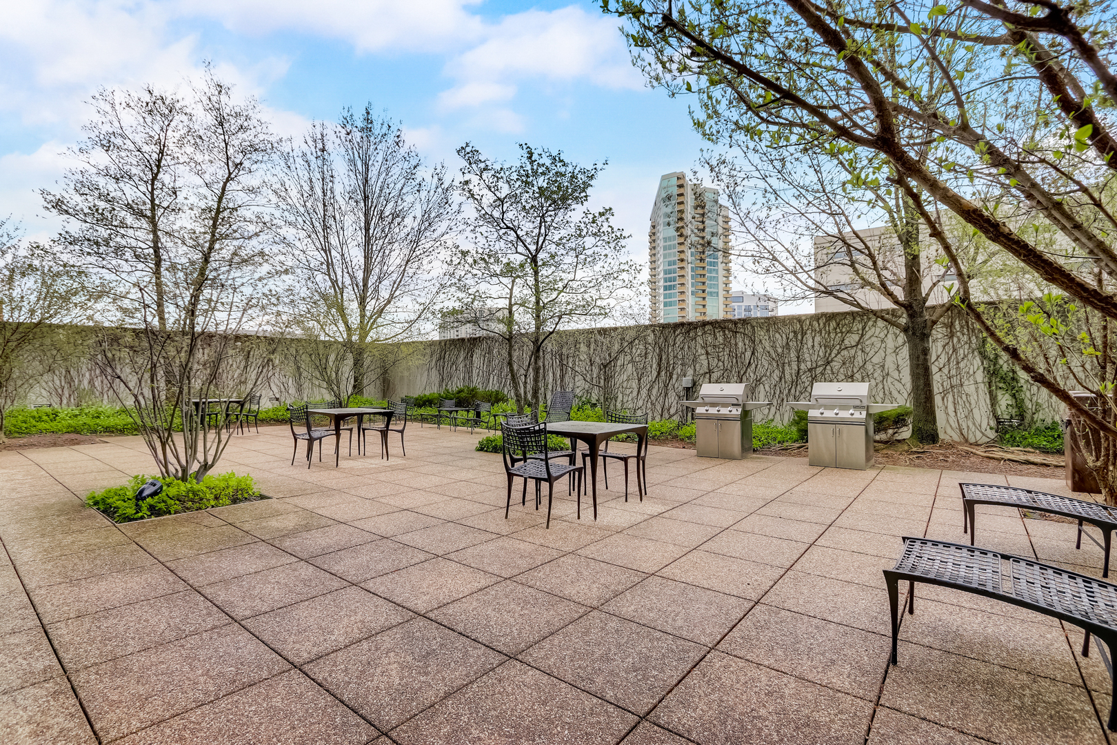 800 Elgin Road, Unit 1220 Evanston, IL 60201 - Photo 35 of 39 a view of a patio with table and chairs and potted plants