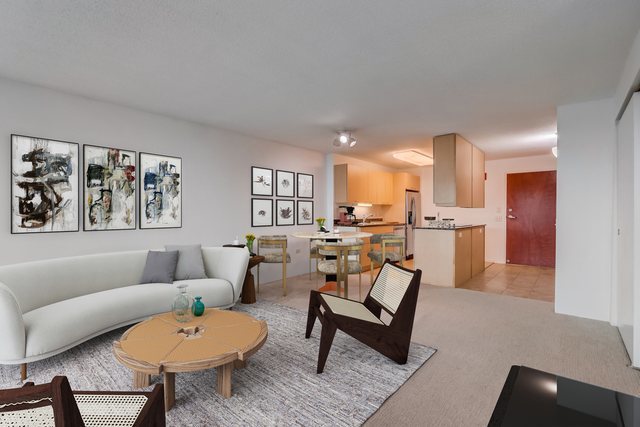 800 Elgin Road, Unit 1220 Evanston, IL 60201 - Photo 4 of 39 a living room with furniture and kitchen view