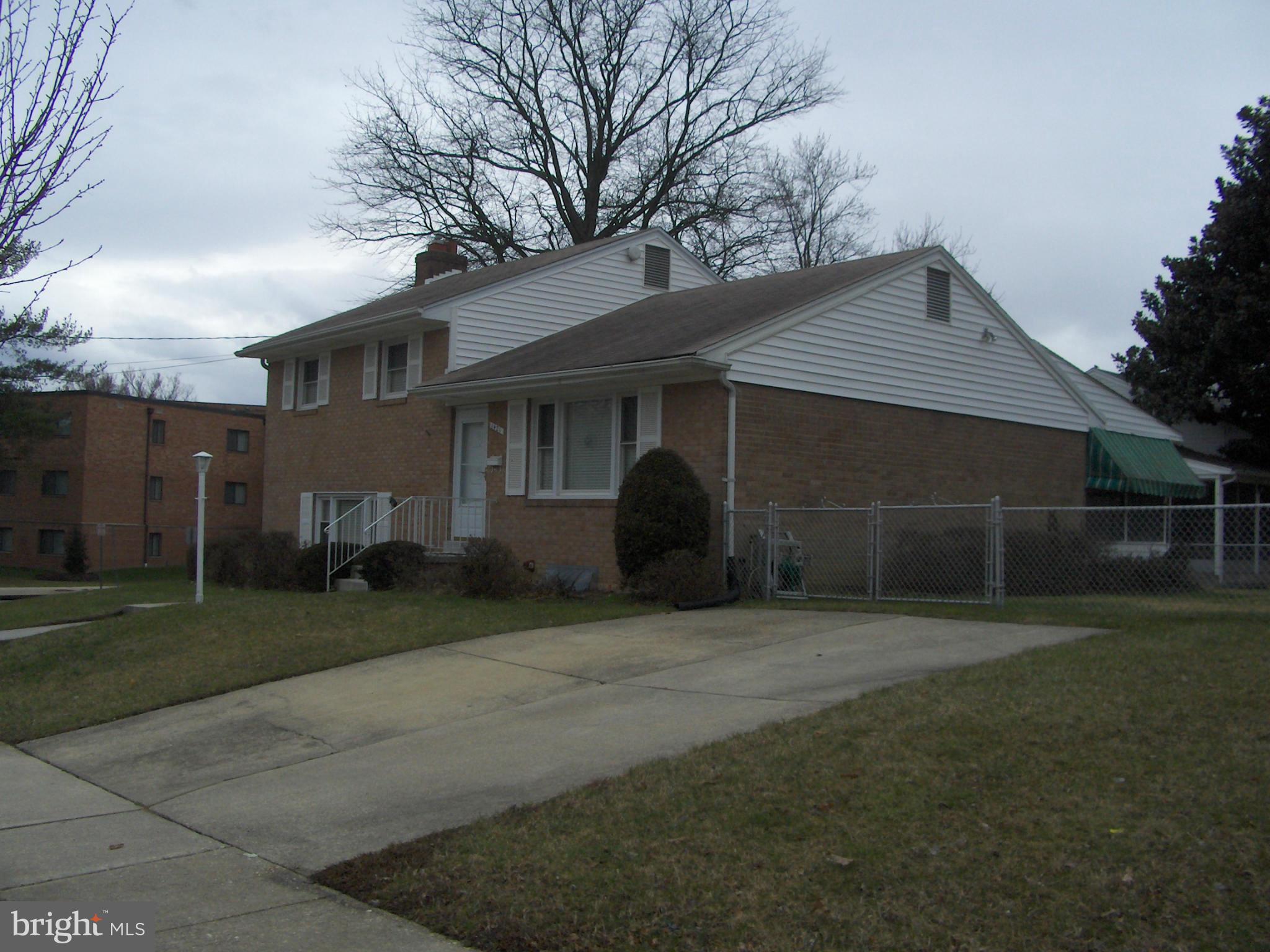 1421 Ray Road Hyattsville, MD 20782 - Photo 3 of 27 a front view of a house with a yard and garage