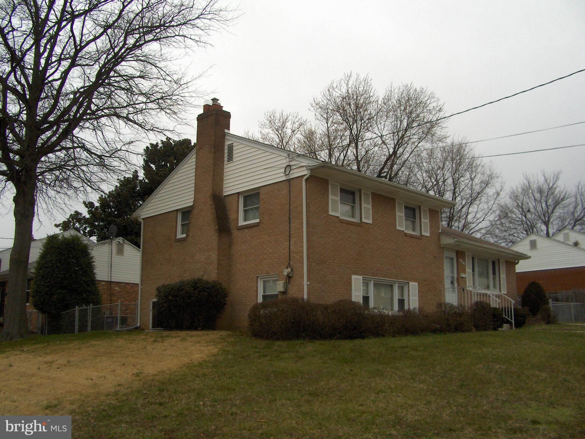 1421 Ray Road Hyattsville, MD 20782 - Photo 4 of 27 a front view of a house with a garden