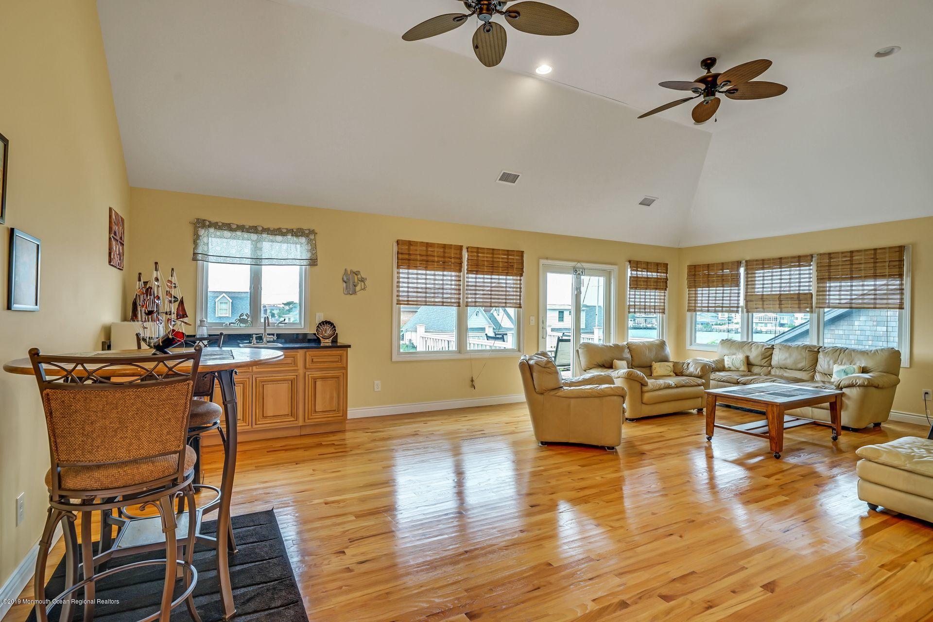 195 Ketch Road Mantoloking, NJ 08738 - Photo 23 of 44 a living room with furniture and wooden floor