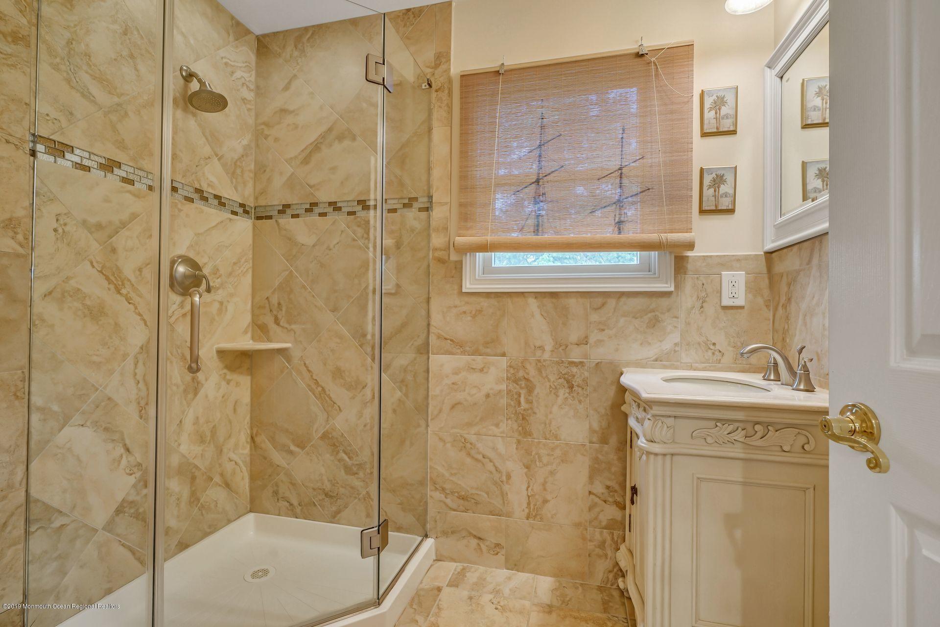 195 Ketch Road Mantoloking, NJ 08738 - Photo 33 of 44 a bathroom with a shower and a sink