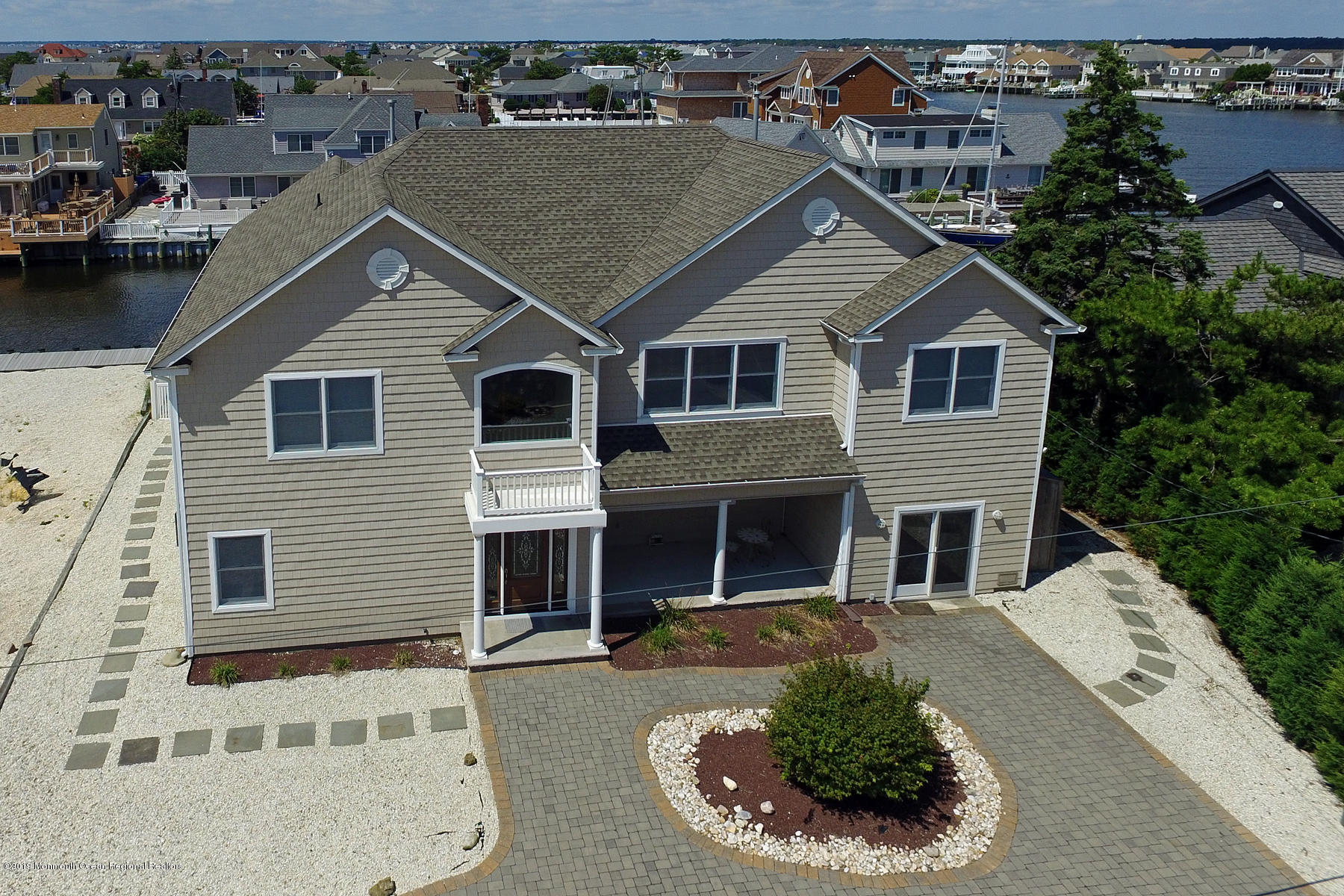 195 Ketch Road Mantoloking, NJ 08738 - Photo 36 of 44 front view of a house with a yard