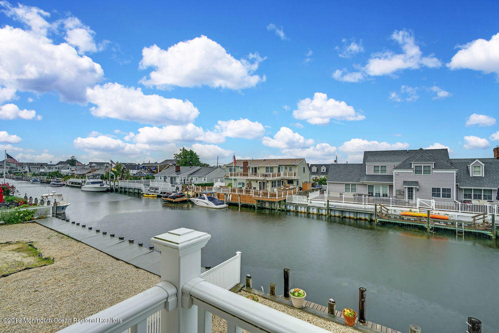 195 Ketch Road Mantoloking, NJ 08738 - Photo 39 of 44 a view of a lake with boats and trees