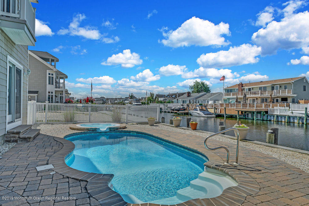 195 Ketch Road Mantoloking, NJ 08738 - Photo 41 of 44 a swimming pool with outdoor seating yard and barbeque oven