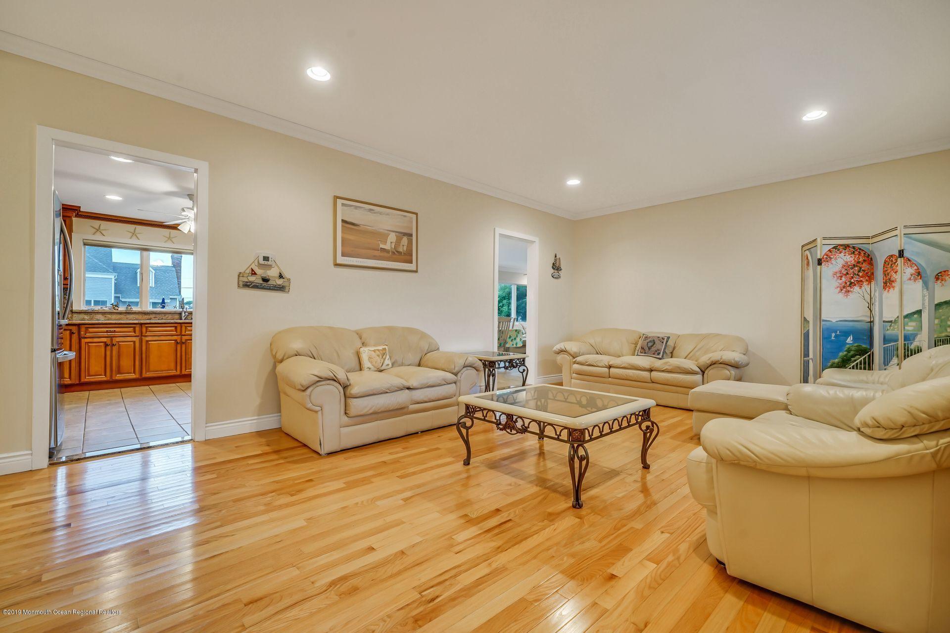 195 Ketch Road Mantoloking, NJ 08738 - Photo 5 of 44 a living room with furniture and a table