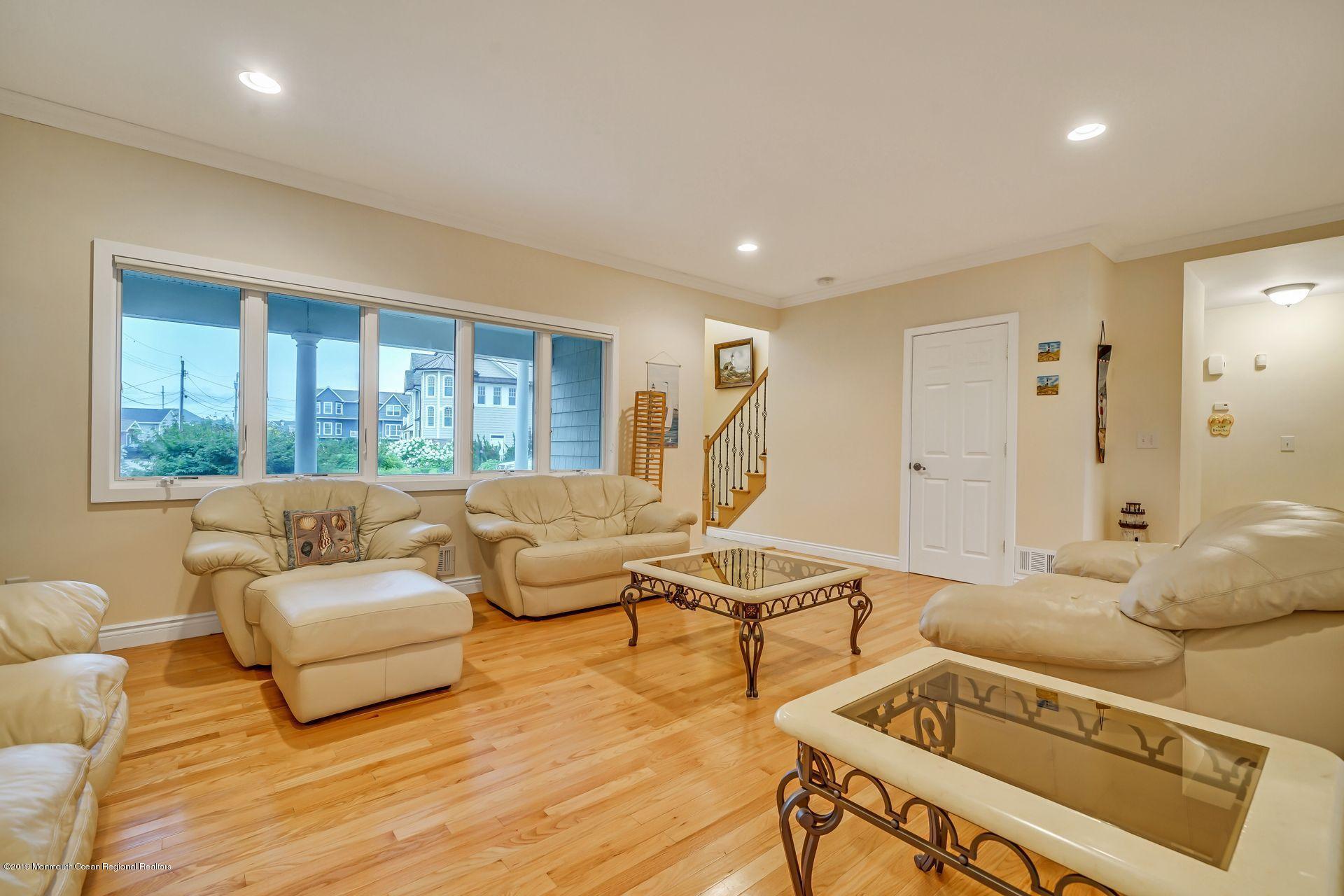 195 Ketch Road Mantoloking, NJ 08738 - Photo 6 of 44 a living room with furniture and a large window