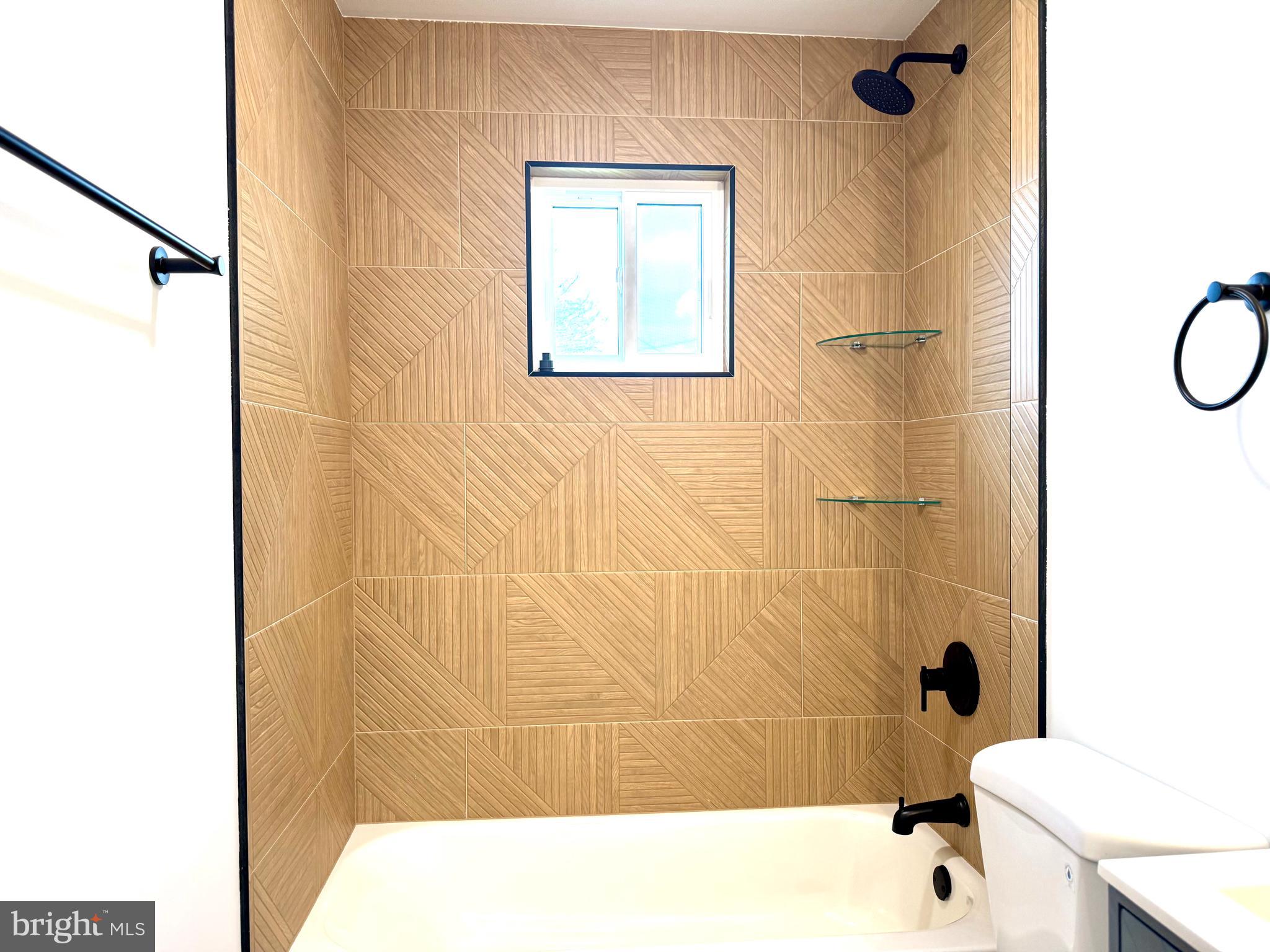 63 Gerard Road Hamilton, NJ 08620 - Photo 12 of 22 a bathroom with a shower and a toilet