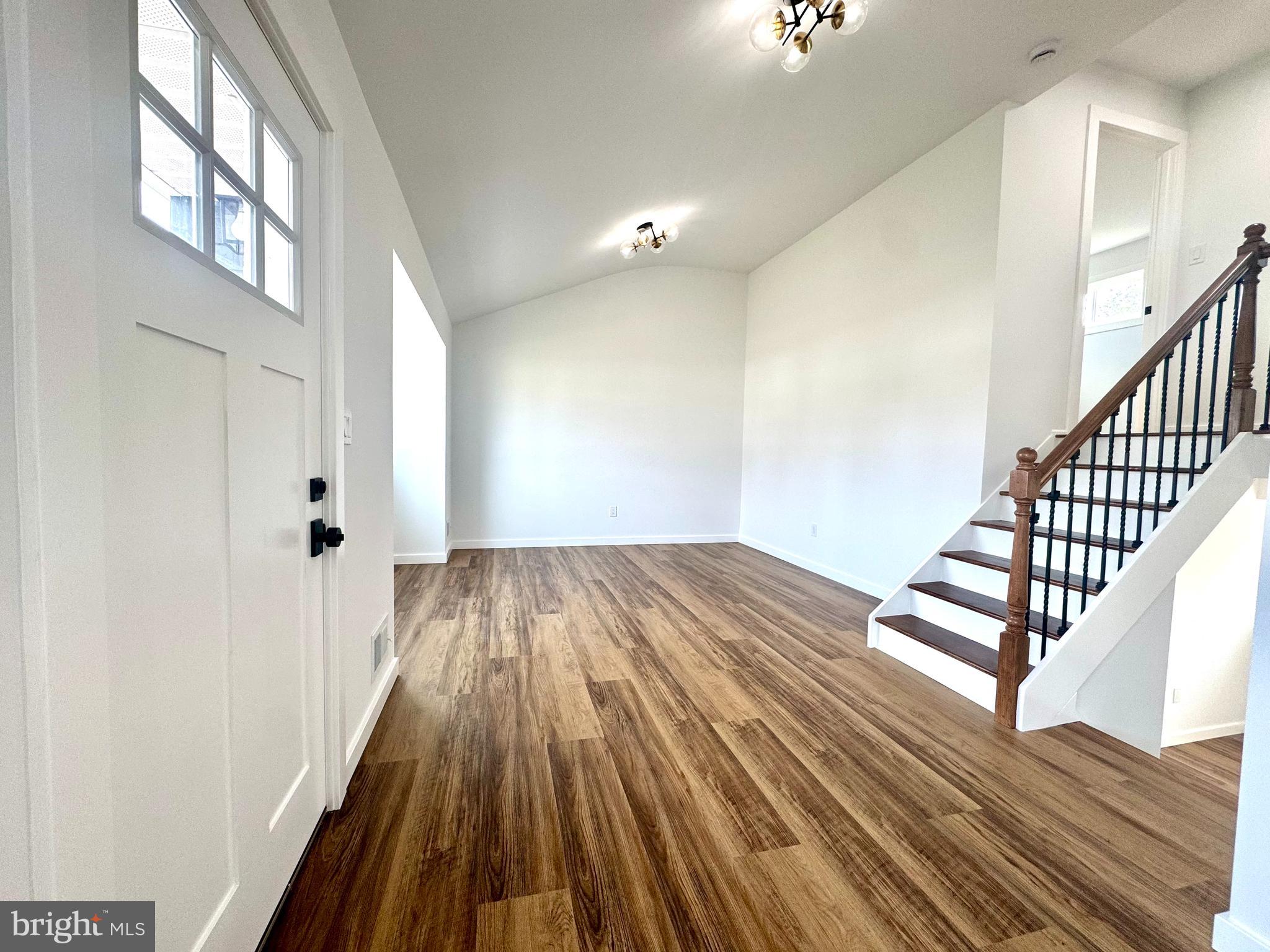 63 Gerard Road Hamilton, NJ 08620 - Photo 6 of 22 a view of a hallway with wooden floor and staircase