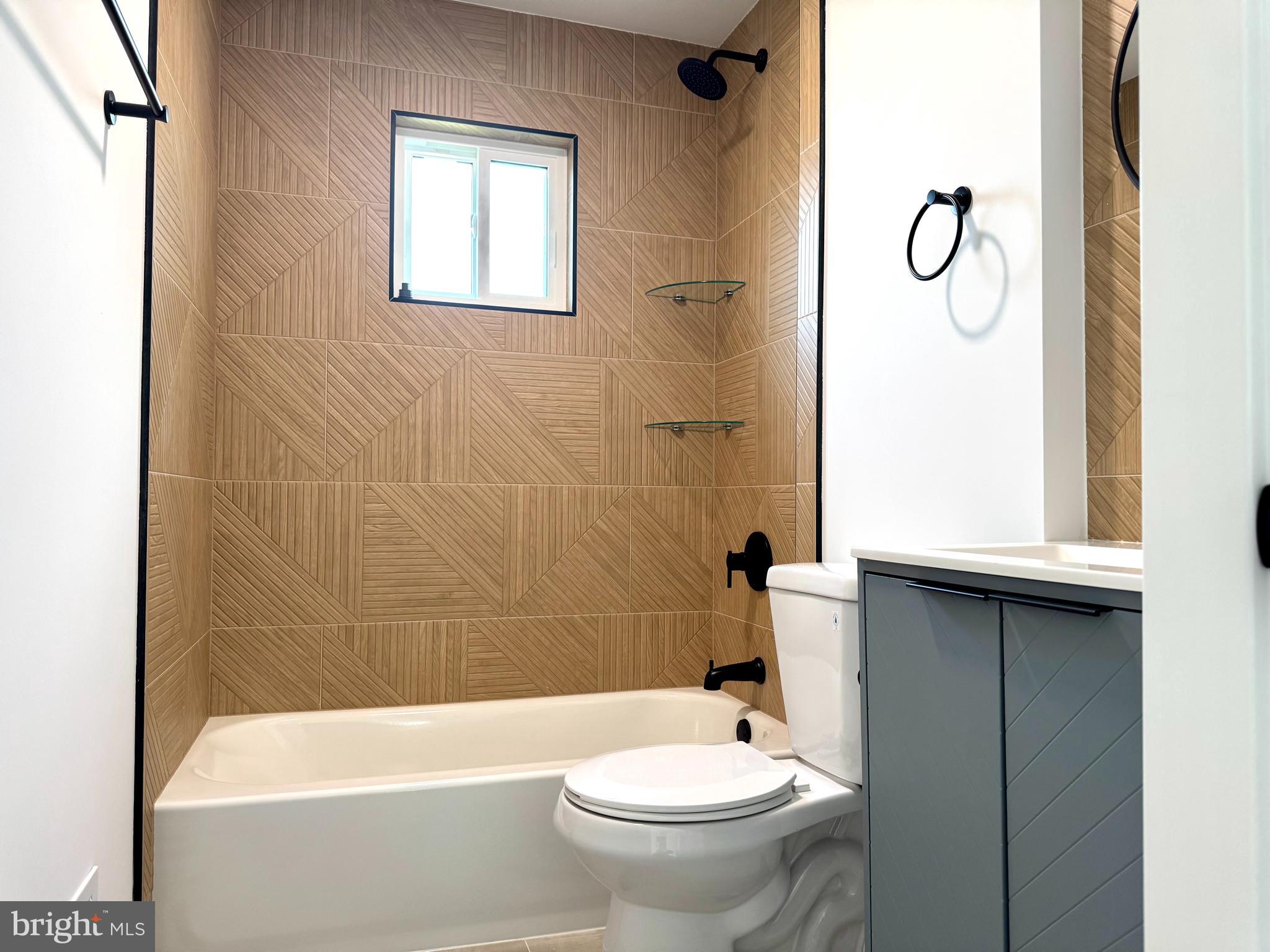 63 Gerard Road Hamilton, NJ 08620 - Photo 10 of 22 a bathroom with a toilet a sink and bathtub