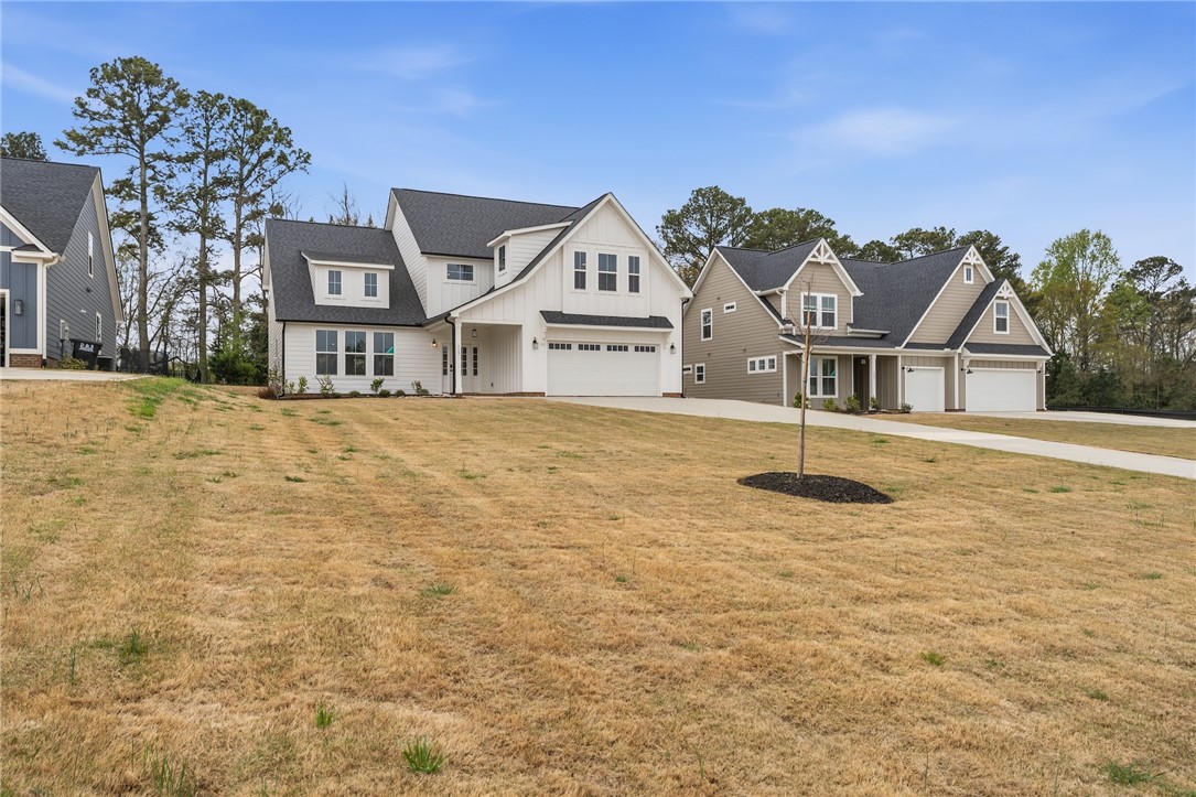 319 Summerall Drive Anderson, SC 29621 - Photo 2 of 37 This newly constructed residence showcases a charming facade and a spacious lot, offering ample curb appeal.
