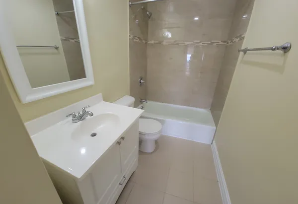 a view of a room with kitchen island lot of furniture and wooden floor