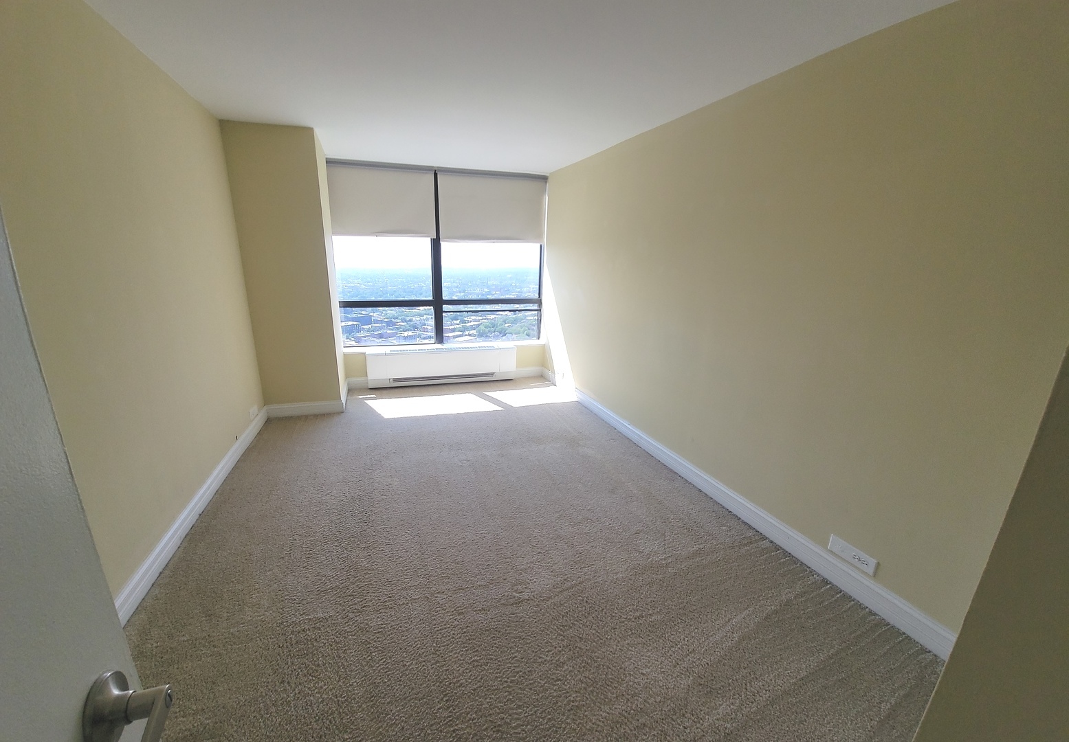 5415 North Sheridan Road, Unit 4414 Chicago, IL 60640 - Photo 10 of 23 an empty room with windows