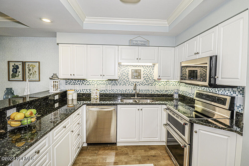 1550 Salter Path Road, Unit 605 Indian Beach, NC 28512 - Photo 8 of 30 Granite counters, LUXURY stainless appliances, breakfast bar