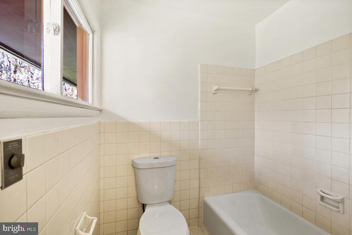 2606 Deerdell Lane Reston, VA 20191 - Photo 34 of 49 a white toilet sitting next to a bath tub