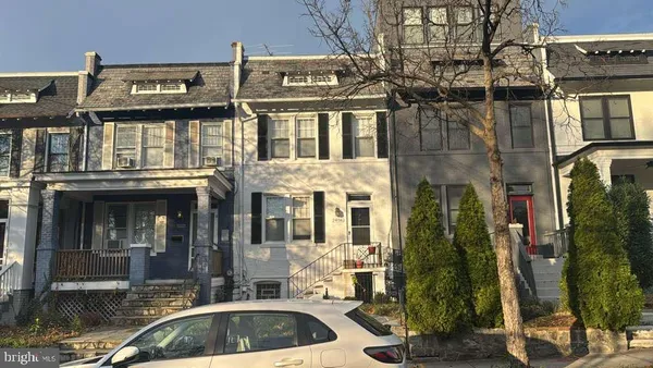 a view of a brick building with many windows