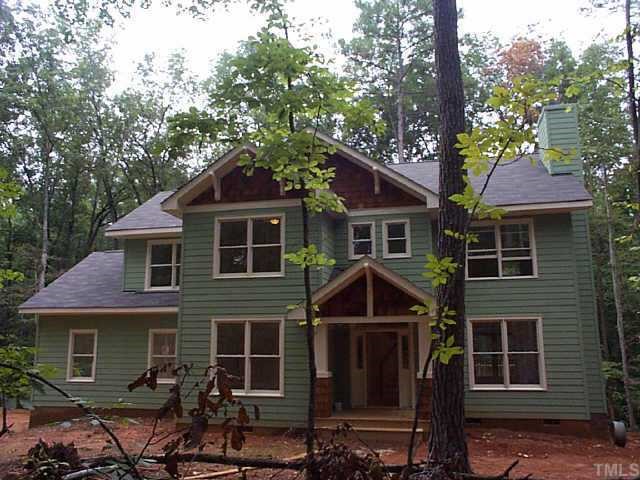 4316 Bradford Ridge Road Efland, NC 27243 - Photo 1 of 1 a front view of a house with garden