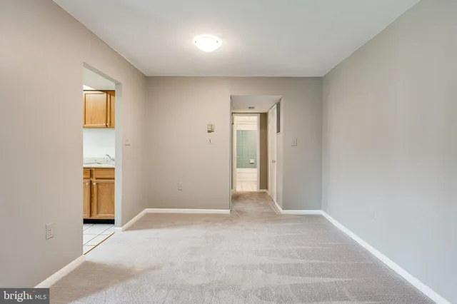 a view of an empty room and a gallery