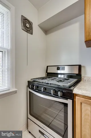 a white refrigerator freezer and a granite counter top