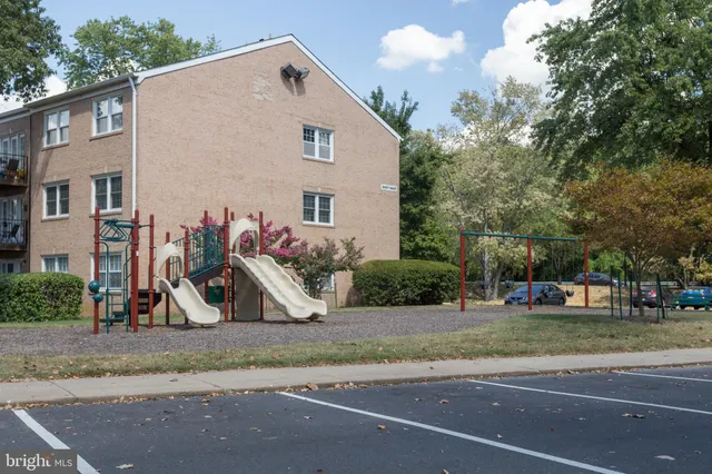a view of a house with a yard and street view