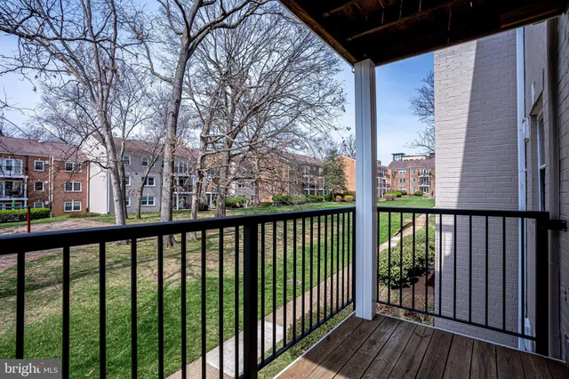 a view of a balcony with wooden floor