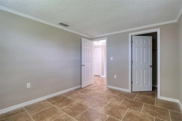 a living room with a table and chairs