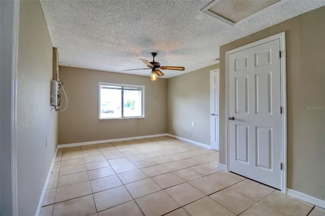 a view of a backyard with sitting area
